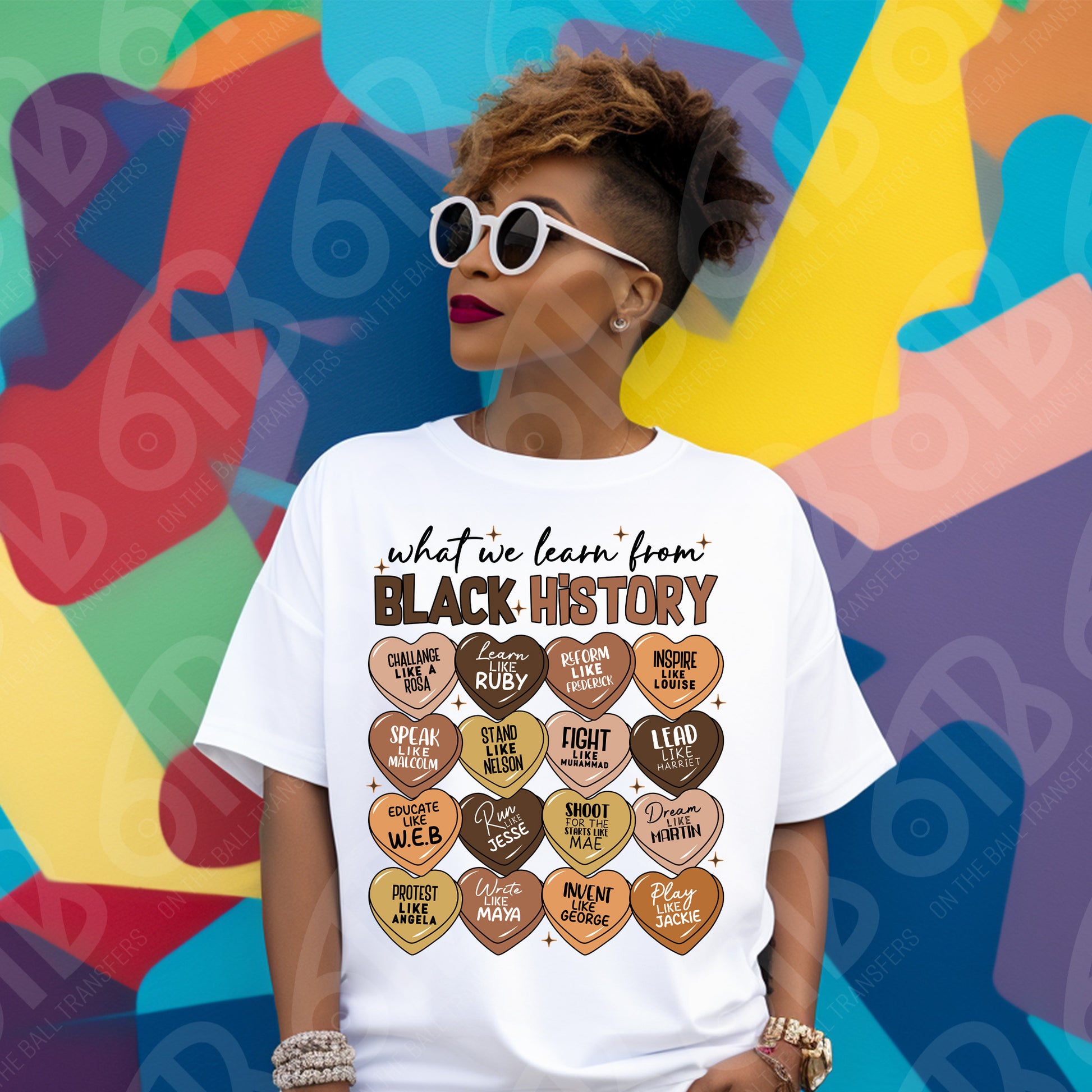 Person wearing a white t-shirt with 'What we learn from Black History' design against a colorful abstract background