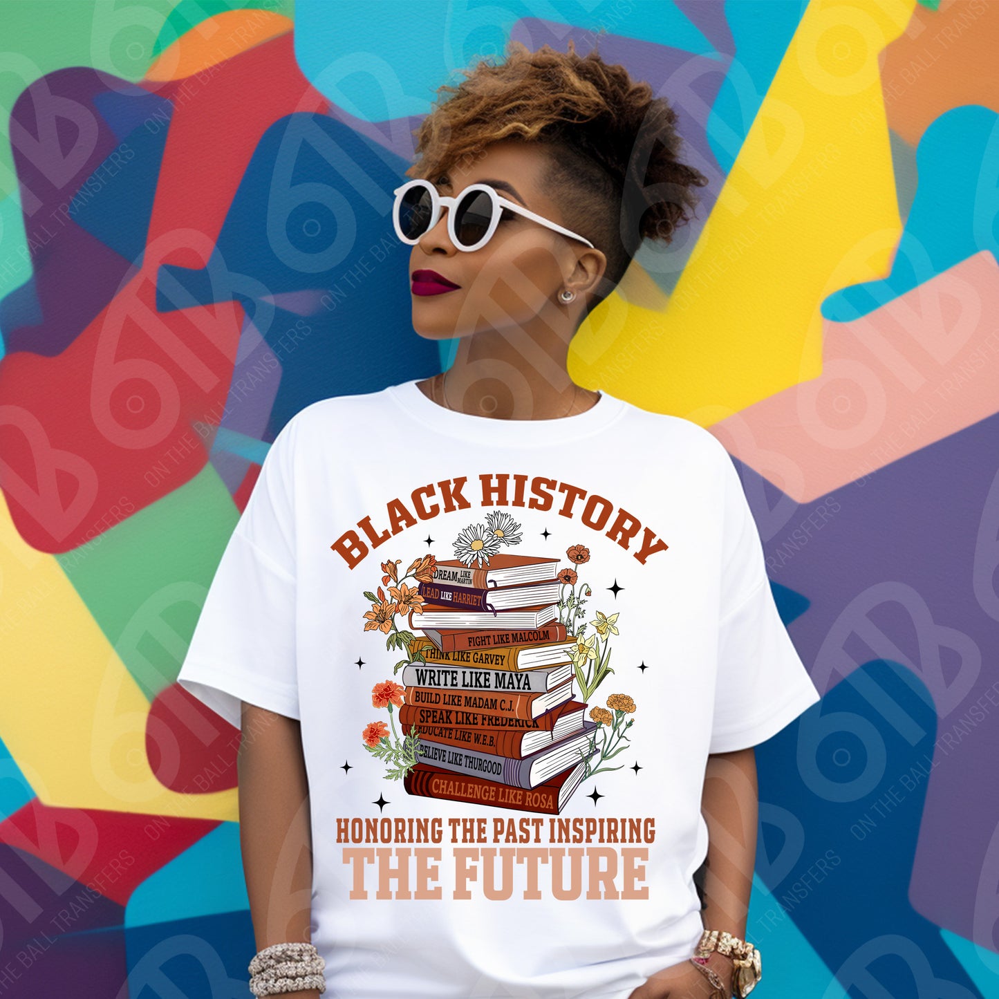 Person wearing a white t-shirt with 'Black History' design against a colorful abstract background