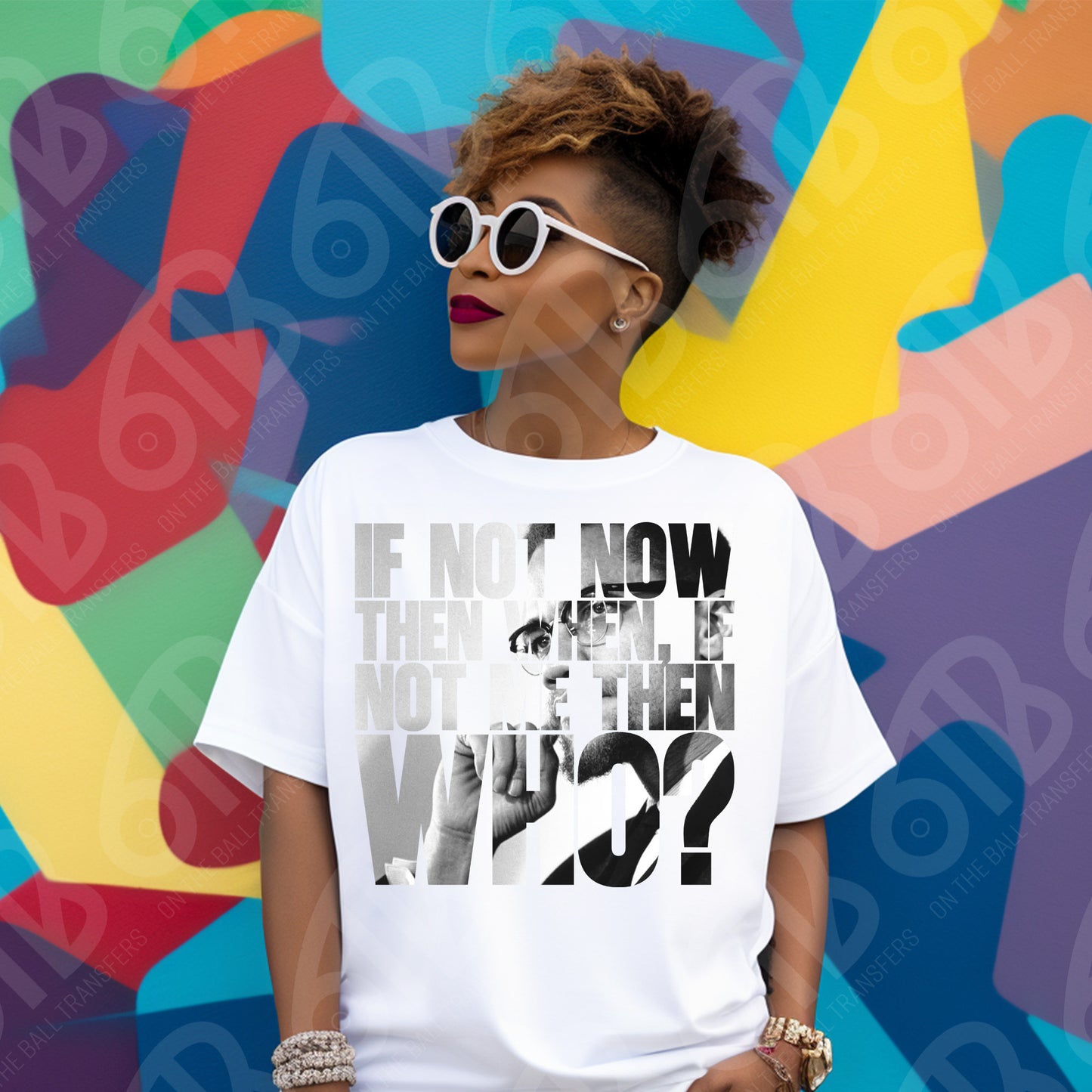 Person wearing a white t-shirt with a graphic design of Malcolm X  in front of a colorful abstract background