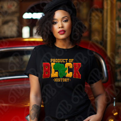 Woman wearing a black t-shirt with 'Product of Black History' design, sitting in a car.